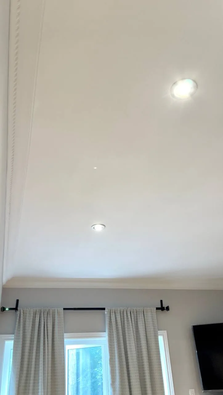 Same ceiling repaired and painted with crown moulding