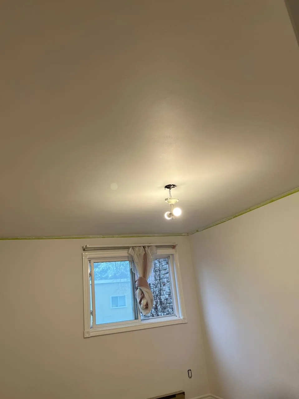 Same ceiling repaired, primed, and painted