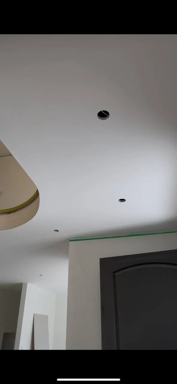 Same foyer ceiling smooth and painted after popcorn removal