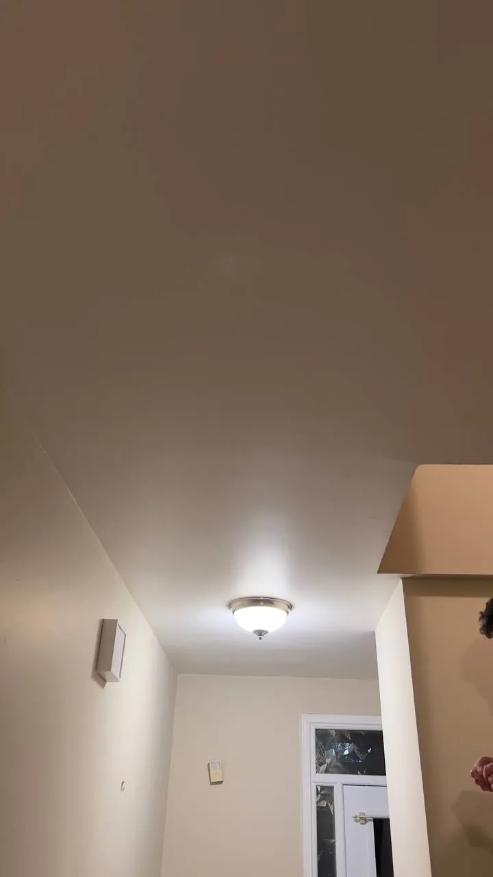 Same hallway ceiling smooth and painted after popcorn removal