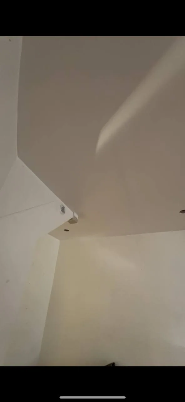 Same vaulted ceiling corner smooth after popcorn removal