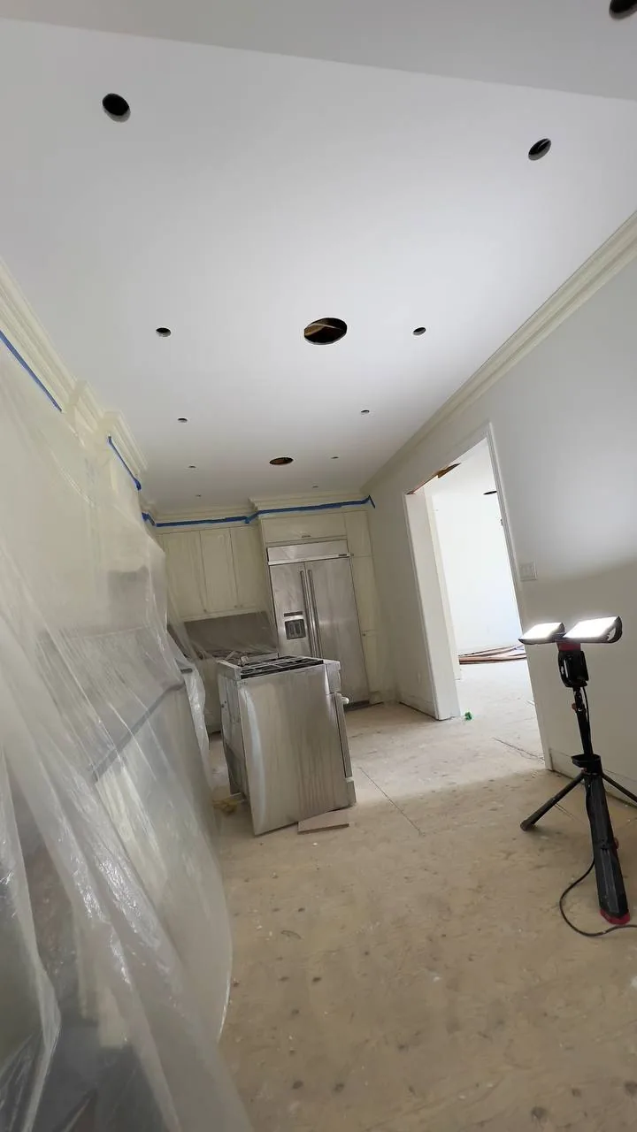 Finished kitchen ceiling and cabinetry after painting work