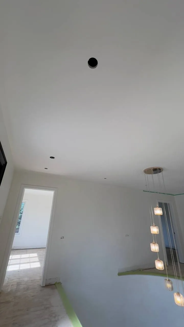 Finished foyer ceiling with recessed lighting
