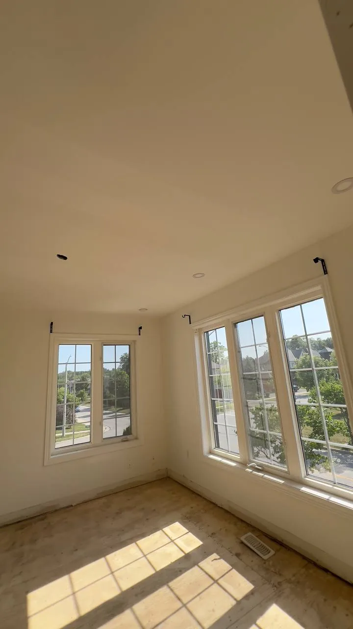 Bright finished room with large windows after painting