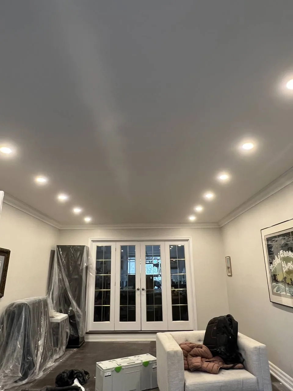Finished living room ceiling with multiple recessed lights