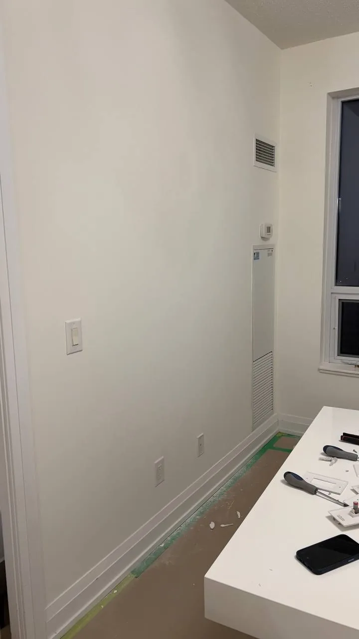 Same wall repaired, plastered, and smoothed ready for paint